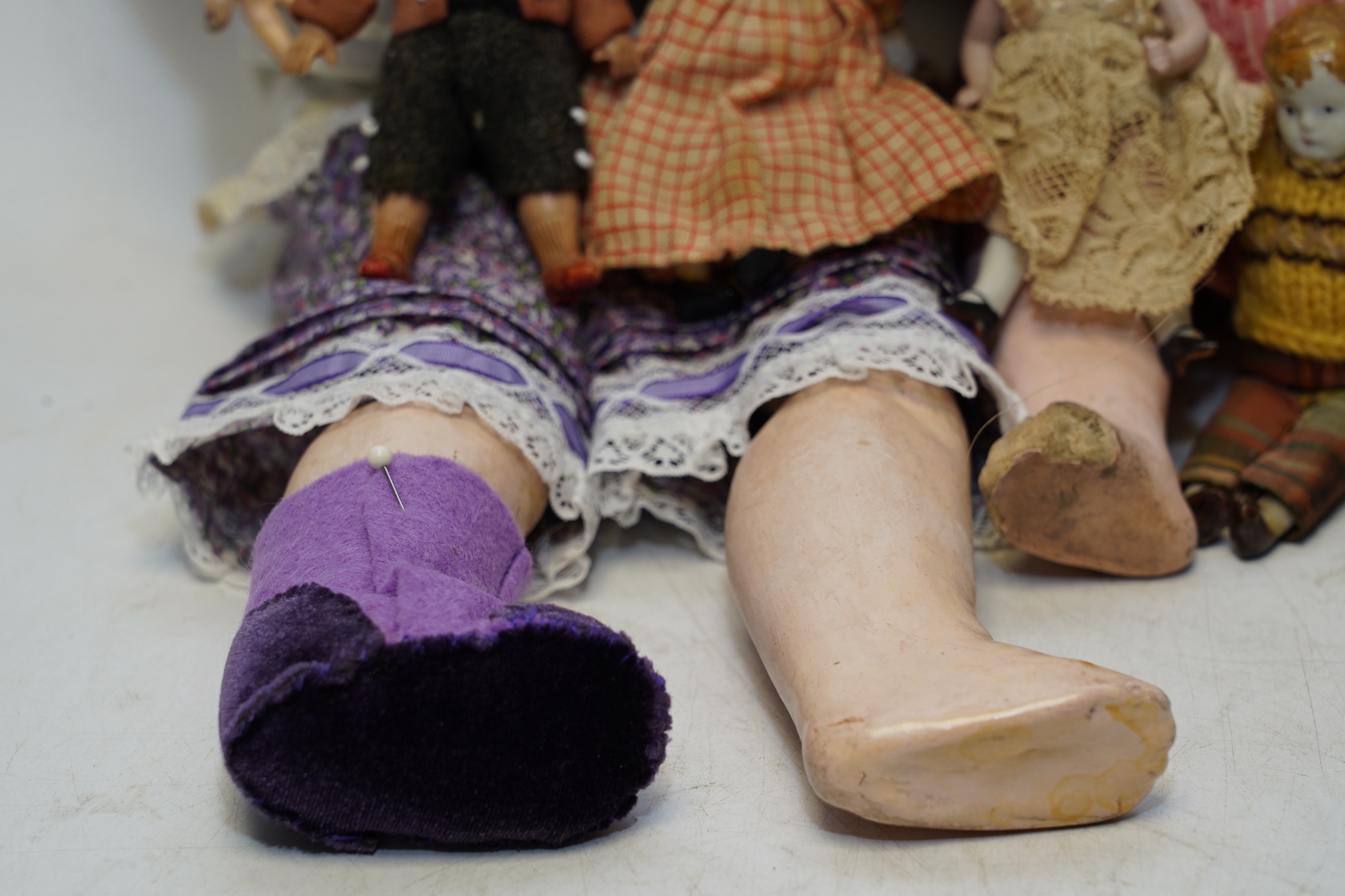 An AM bisque headed doll, an SFBJ 60 bisque doll and four miniature dolls. Condition - poor to fair